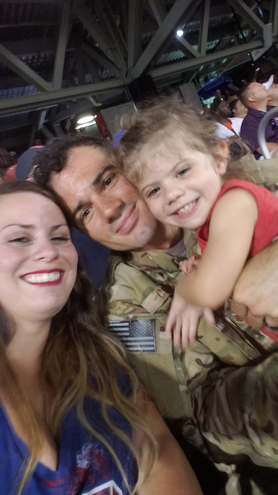 Cole reunites with his wife and daughter after a deployment
