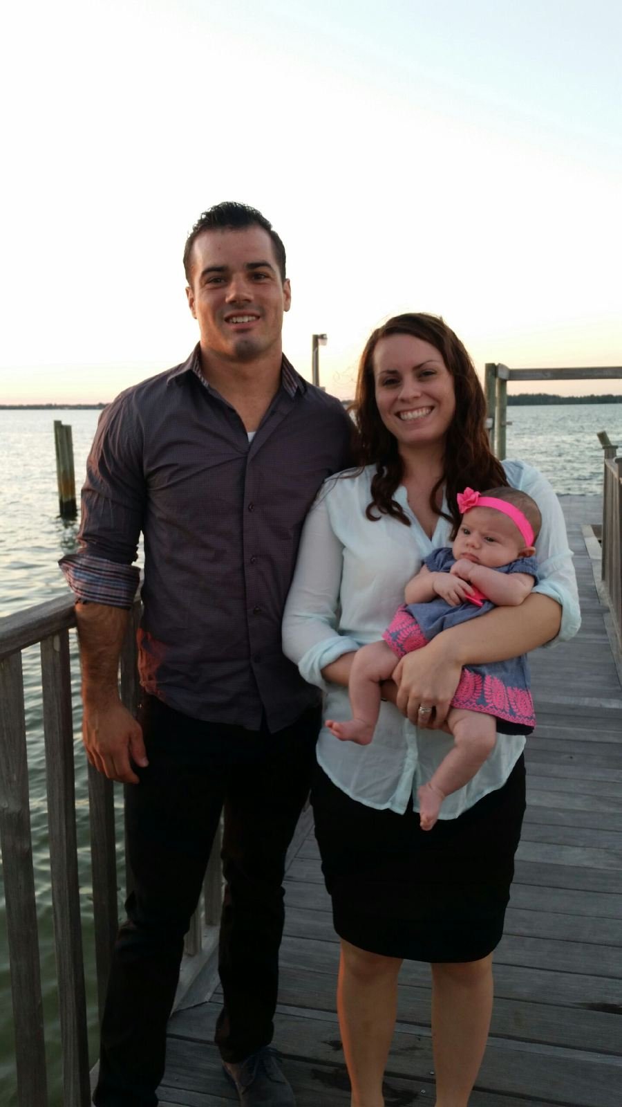 Cole and his wife with their newborn daughter