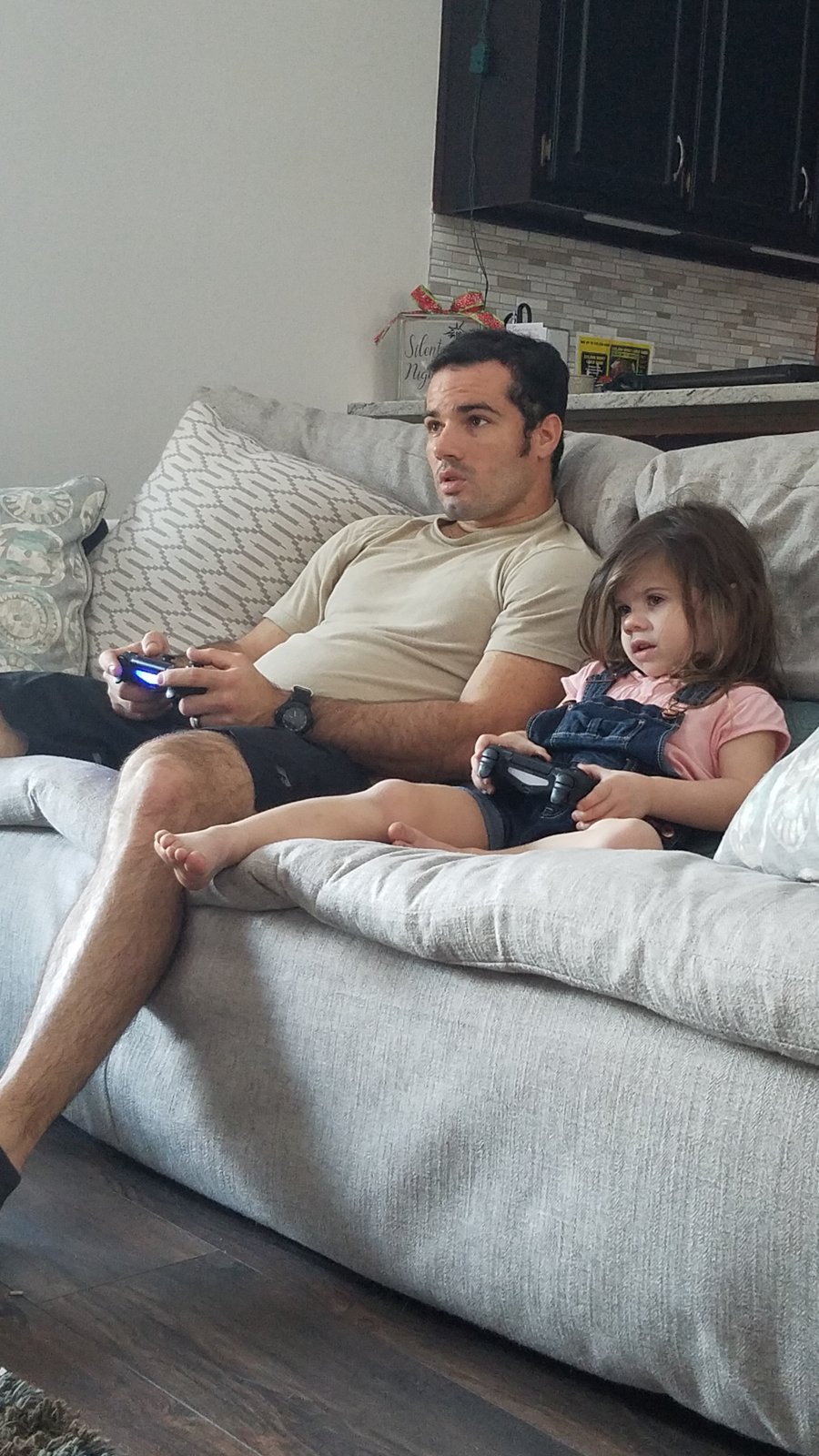Cole playing video games with his daughter